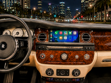 Load image into Gallery viewer, Rolls-Royce Phantom Series II 2013-2017 Apple CarPlay screen upgrade
installed in the center dash, wide touchscreen running the CarPlay home
screen between the round chrome air vents