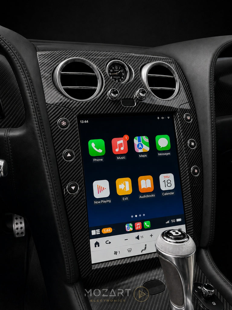 Bentley screen upgrade in carbon fiber trim, installed in a Continental GT with red leather interior