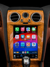 Load image into Gallery viewer, Bentley screen upgrade in light woodgrain trim running the Apple CarPlay home screen after installation