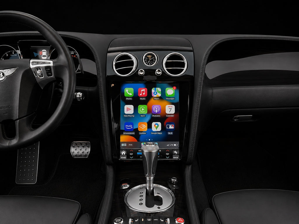 Bentley Continental GT dashboard after the screen upgrade with piano black trim seen from the driver seat