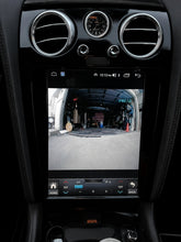 Load image into Gallery viewer, Reverse camera view on the upgraded Bentley touchscreen in piano black trim while parking