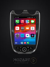 Laden Sie das Bild in den Galerie-Viewer, McLaren CarPlay screen upgrade in matte carbon fiber, front view running the Apple CarPlay home screen